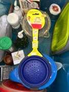Tote full of miscellaneous household/kitchen items…..2 teal pitchers (acrylic and heavy plastic, collapsible strainer, splatter screen and more