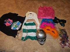 Miscellaneous grouping. Super Grover t-shirt,pink apron, Mardi gras style masks, beads, polar bear hat, and more.