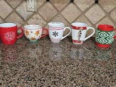 Nice grouping of cocoa mugs.