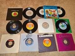 Grouping of 45's records. "Christopher" is a vintage Captain Kangaroo version. See all photos for various titles.