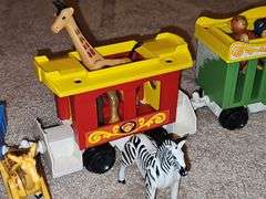 Fisher Price Little people playsets as shown. See all photos. Some pieces have some melting from attic storage as seen on elephant in last photo.