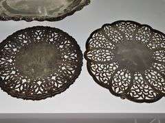 Silver plate bowls, covered dish, and trivets.