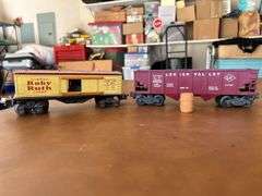 Selection of (2) Lionel Train Cars…..Baby Ruth car needs repair