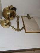 Grouping of brass items. Large apple, small apple, anchor, pineapple note holder.