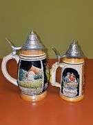 2 steins. One is 7.25 in from West Germany,  8.25 in is from Germany