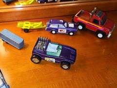 Diecast vehicles. All have been played with. The train in the front is Midge Toy, most of the rest are Tootsie Toy.