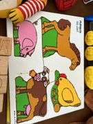 Table full of vintage toys…..Tuggy Tooter does still work, wooden puzzles, Jack-In-The-Box turns but no music nor does he pop out, wooden blocks and more