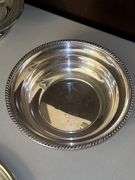 Very nice selection of silverplate items……compote, 2 small bowls, medium-sized bowl, rose bowl(?), and round serving tray