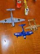 Toy vehicle grouping. Larger vehicles in the back are plastic, planes and General Lee cars or metal diecast.