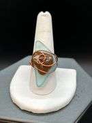 Uniquely designed copper wire ring with blue & brown stone…..size 10