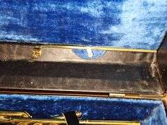 King brand trombone with regular slide and keyed slide. Keys need oil. Mouth mouthpiece included along with music stand.
