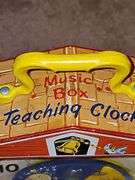 Vintage Fisher-Price toys. Snoopy and teaching clock in working order. Sparkling symphony star sticker needs batteries.