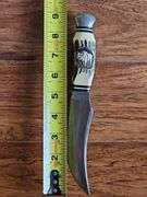 Original Buffalo Skinner knife from Silver Springs Florida with imitation bone handle and leather sheath.
