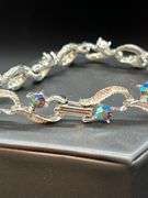Beautiful vintage silver tone bracelet with sparkling iridescent stones…..7” long…..matching choker is lot 99