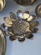 Very nice selection of silverplate items……compote, 2 small bowls, medium-sized bowl, rose bowl(?), and round serving tray