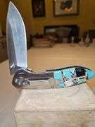 Two(2) large folding knives...