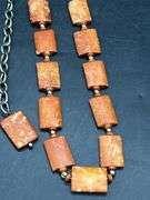 Adjustable waist size rust colored beaded ladies belt