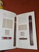 Two Sir Winston wood cigar boxes, cigar pen, and The Cigar Companion hardback book with dust cover.