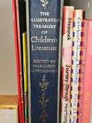 Grouping of children's books and a Bible verse.