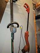 Black & Decker electric 22-in hedge trimmer and black and Decker electric weed eater