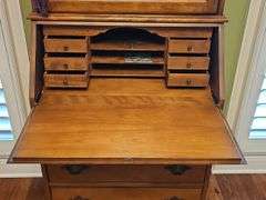 Wood secretary with two doors and 3 drawers. Keys work locks properly. 26.5 x 15.5x 71.5 in tall. Content's not included.
