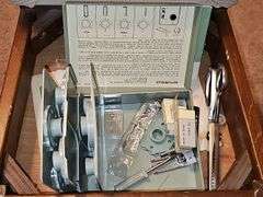 Vintage Sears Kenmore sewing machine in cabinet with storage chair. Closed cabinet is 22.5x18 X 30 in tall. Chair is 16 X 13 X 27.5 in tall. Seat height is 17 in