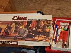 Three vintage Mickey mouse characters, board game Clue, miniature air hockey game untested,  poker chips and cards, and Jenga.