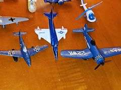 Toy vehicle grouping. Larger vehicles in the back are plastic, planes and General Lee cars or metal diecast.