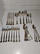 Old company plate flatware possibly Signature Rose pattern. Four dinner forks, four salad forks, five soup spoons, four iced teaspoons, four dinner knives, two serving spoons, one ladle, one cold meat fork, one sugar spoon, and one butter knife. No monogram.  Circa 1940s