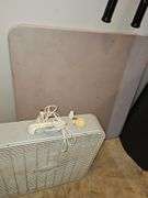 Square card table and box fan.