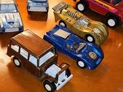 Diecast vehicles. All have been played with. The train in the front is Midge Toy, most of the rest are Tootsie Toy.