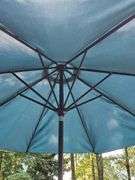 Glass top table, four swivel chairs, and umbrella.