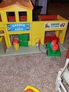 Fisher Price Little people playsets as shown. See all photos. Some pieces have some melting from attic storage as seen on elephant in last photo.