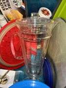 Tote full of miscellaneous household/kitchen items…..2 teal pitchers (acrylic and heavy plastic, collapsible strainer, splatter screen and more