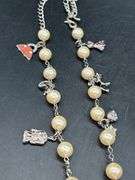 Adjustable waist size iridescent pearl-like beaded belt with charms