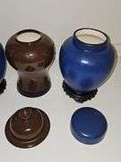 Three ceramic urns. 9.25 in and 11.25 in tall.