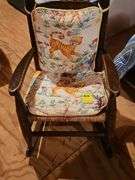 Wonderful vintage child's rocker with rush seat.