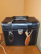 Single slide projector and leather camera bag with case for Canon camera. No camera included. Also includes a portable slide/movie screen.