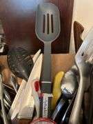 Box of kitchen utensils……knives, spoons, spatulas, corer and more…..there is a new calphalon slotted and new carving set (see pics)