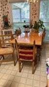 Exquisite custom built table and chairs……custom built in 1972 in Nicosia, Cyprus from oak(?). There are no nails except on the chairs to hold the rush seating in place. Chairs are hand carved…..one small blemish on table top