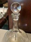 (2) very nice looking clear glass decanters…..left is unmarked (10–/4 tall) and right is Pottery Barn (9” tall)