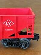 Selection of (2) Lionel Train pieces…..242 Steam Engine (with damage) and Lehigh Valley (L.V. 25000) red rail car