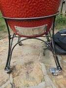 Red Kamado Joe Grill on rollaround iron stand w/cover and some like new accessories...
