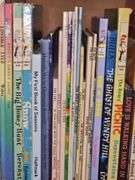 Bookcase and great grouping of children's books. Bookcase is 21.25 X 10.75 x 28.25 in tall. See all photos for titles.