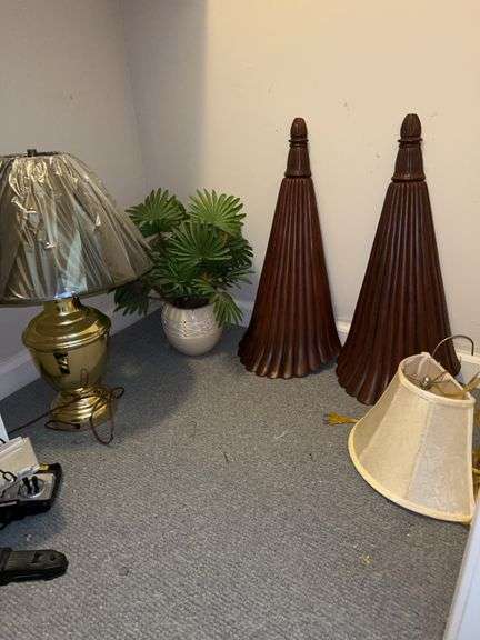 Contents of home decor in corner of closet image