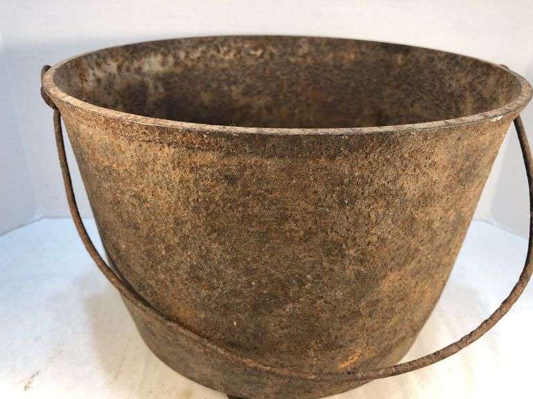 Antique gate marked 19th-century Louisiana cast iron sugar kettle. These large, spherical cast iron kettles were primarily used in the production of sugar on plantations in the American South, especially in Louisiana where sugarcane cultivation thrivedMarked 8 MG. 10” diameter. 8” H.