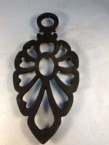 Vintage Wilton cast iron trivet. 8 x 4”.