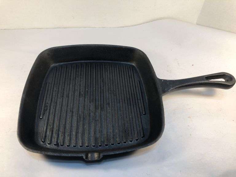 Internationals black cast iron 9” square ribbed griddle pan with pour spout. 1 1/4” D. No spin, no wobble. image