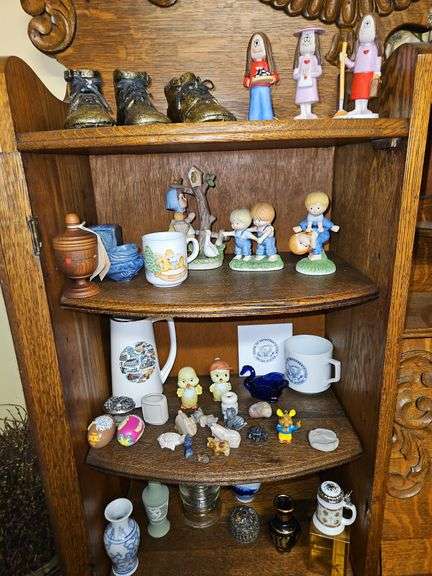 Collection of items on four shelves as shown in pics... image