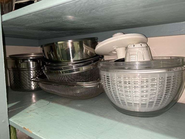 Selection of various size strainers and salad spinners image